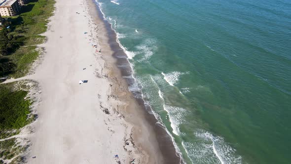 Tourists on Vacation Enjoying Sunny Florida Beach in Cocoa, Aerial alt