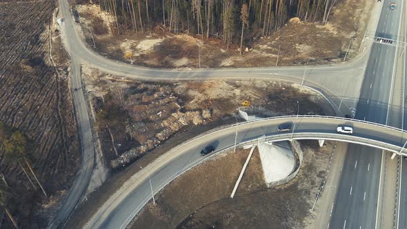 Automobile Highway with a Roundabout of Vehicles View From the Top alt