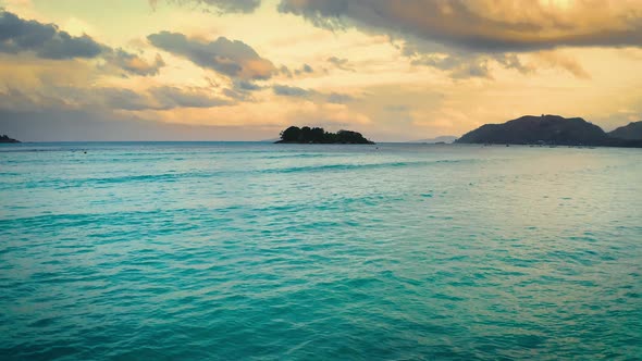 Flying Above the Coast of Praslin Island in Seychelles at Sunset alt