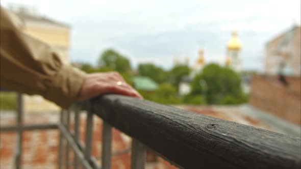 Married Girl Removes Her Hands From the Railing of the Balcony