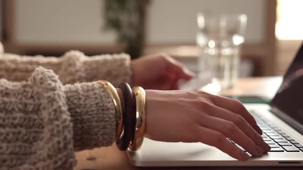 Young Blogger at Work Typing her New Post alt