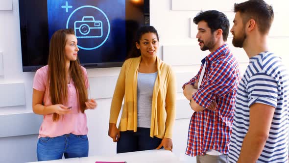 Business executives interacting with each other alt