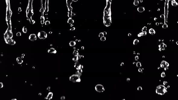 Super Slow Motion Shot Of Falling Water Droplets Isolated On Black Background At 1000fps By Crustoff