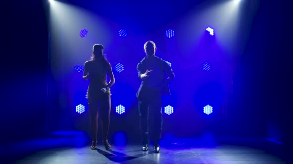 Concept of Social Dance and Relationships, Silhouette of Young Beautiful Couple Dancing Sensual alt