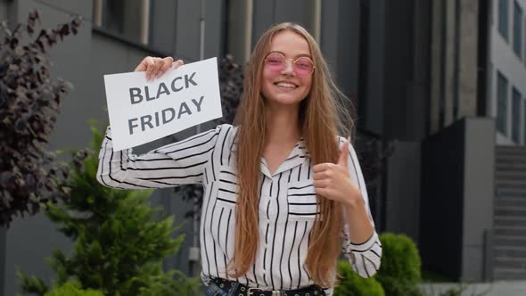 Girl Holding Black Friday Text Inscription, Rejoicing Good Discounts, Low Prices for Online Shopping alt