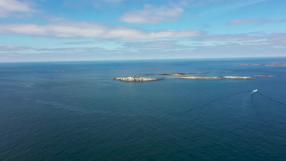 Aerial footage of the seaside coastal town of the village of Seahouses in the UK alt
