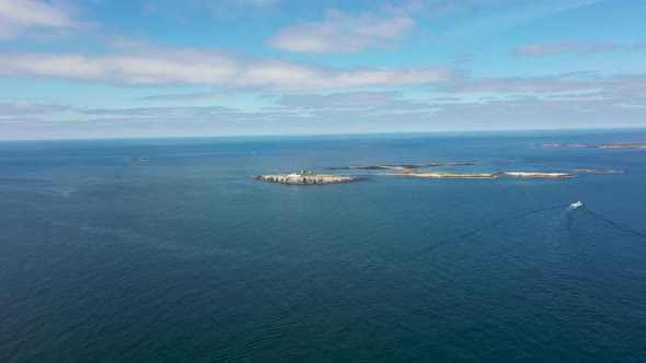 Aerial footage of the seaside coastal town of the village of Seahouses in the UK