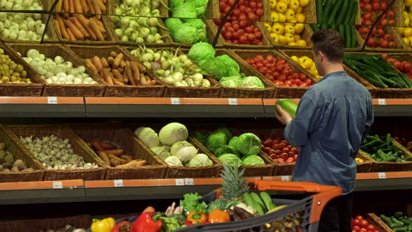 Guy Buys Napa Cabbage at the Supermarket