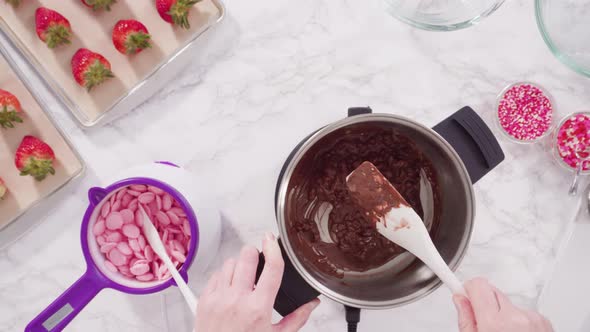 Flat lay. Step by step. Melting chocolate chips in chocolate melting pots. alt