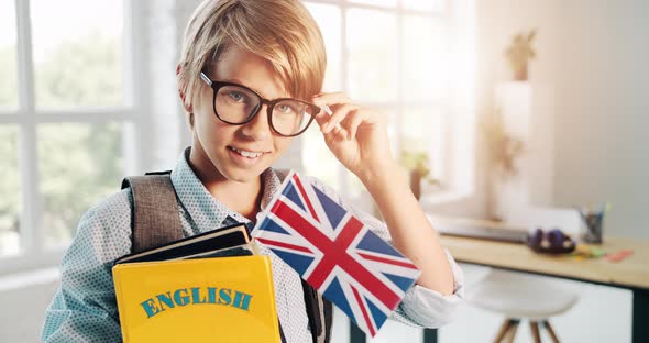 Boy with English Book in Eyeglasses