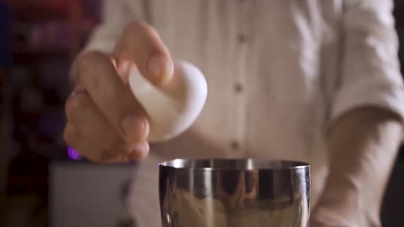 Bartender's Hands Breaks the Egg Protein Flows Out of the Egg Into the Shaker