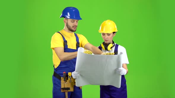 Two Architects Discuss the Drawing of the New Building, Green Screen alt