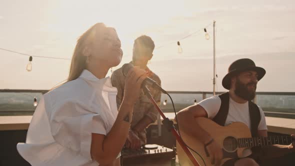 Musicians Playing at Party on Rooftop Terrace alt