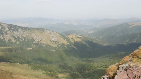Valley under Midzor peak slow pan 4K 2160p 30fps UltraHD footage - Bulgarian side of Stara planina b