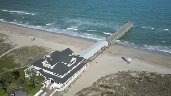 Crystal Pier in Wrightsville Beach Aerial circling around 4k alt