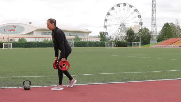 Graceful Slim Woman Warming Up at City Stadium