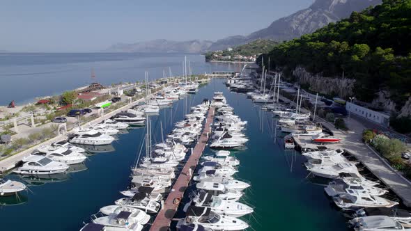 Drone  Aerial of the Marina with Yachts Near the Mountains