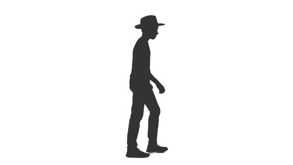 Silhouette of Stylish Teen Boy Walking in Hat