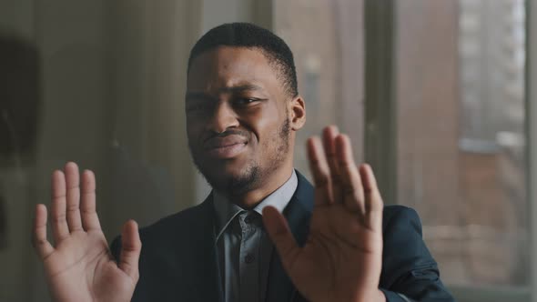 Portrait of Unhappy Ethnic Business Man Afro American Worker Standing in Office Against Window alt
