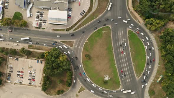 Circular Movement of Cars, Ring Road. Aerial View, Cars Enter the Ring Road. Road Junction in the