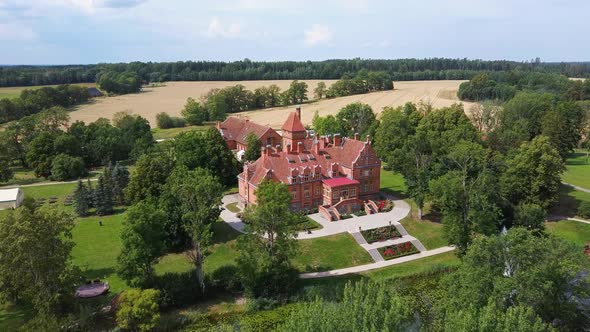 Jaunmoku Brick Medieval Castle Near Tukums, Latvia  Aerial Dron 4k Shot Jaunmokas Manor Park. alt
