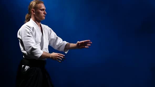 Two Fighters Participants of the Training in Special Clothes of Aikido Hakama Work Out the Methods alt
