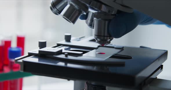 Close-up Shot of Sample Slide and Microscope. alt