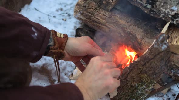 Native Warrior Man Lights Campfire alt