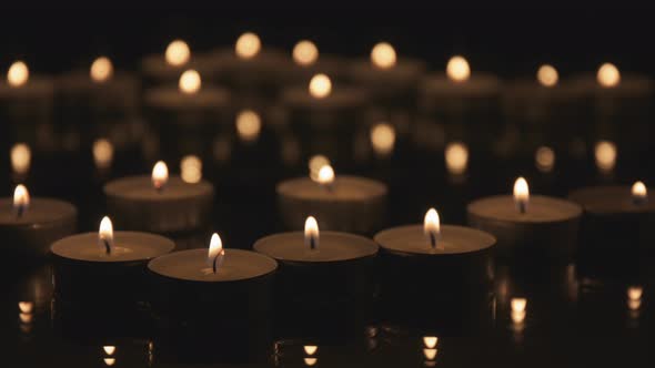 Many Cinemagraph Candles Burning in The Dark.