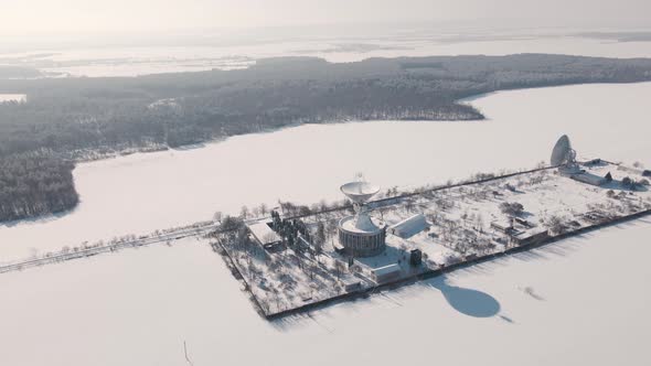 Aerial View of the Space Communication Station in Snow Covered Field at Sunny Winter Day Drone alt