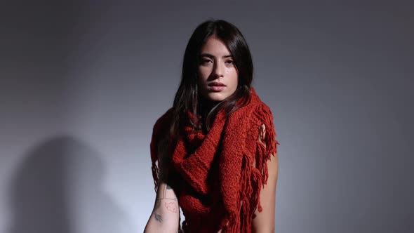 Woman Posing and Dancing in Knitwear Scarf alt