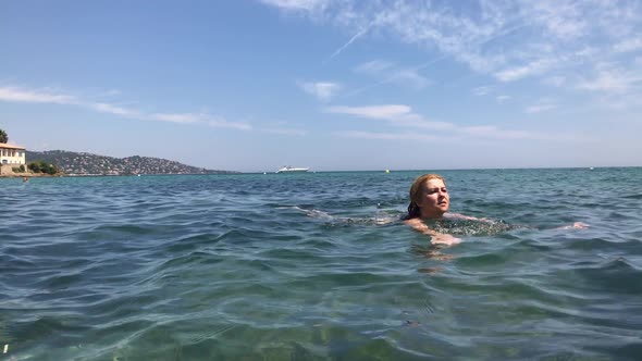 Blue French coast  water swimming slow-mo 1920X1080 HD footage - Caucasian woman in  crystal clear s alt