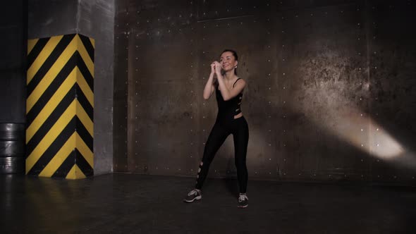 Athletic Beautiful Woman Doing Exercises in the Gym alt