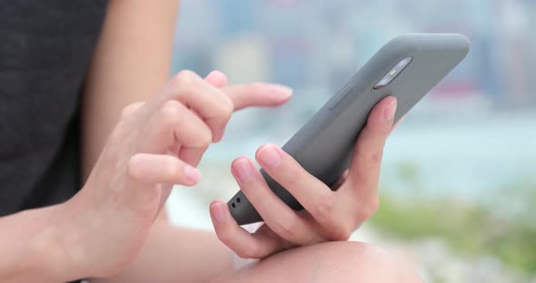 Close up woman use of smart phone at outdoor  alt