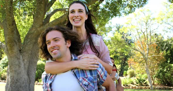 Hipster men holding their girlfriend and running alt