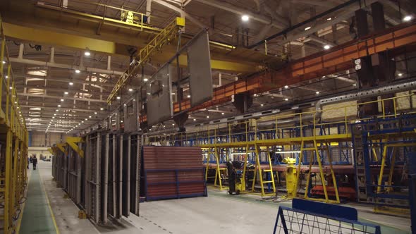 Automated Crane is Moving with Steel Structures for Train Car Assembly