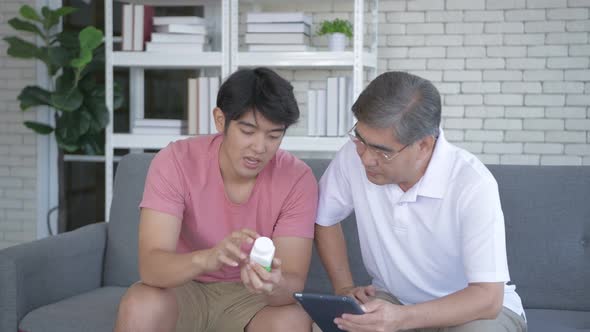 Family concept. The son was explaining about the medicine to his father alt