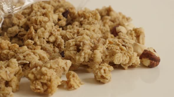 Opened bag with crunchy cereals 4K 2160p 30fps UltraHD footage - Sweet muesli with hazelnuts  flavor alt