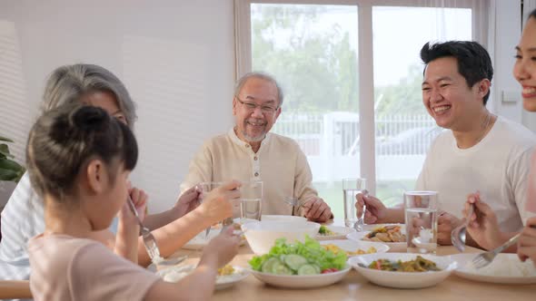 Multi-Generation relationship Asian Big happy family spend time have lunch on dinner table together alt