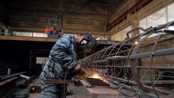 Worker at a welding plant at a metal plant alt
