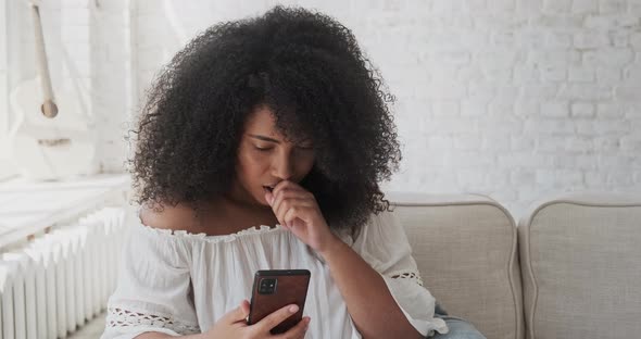 Suprized Shocked Woman Looking at Smartphone Screen Watching Strange Weird Funny Photo or Video
