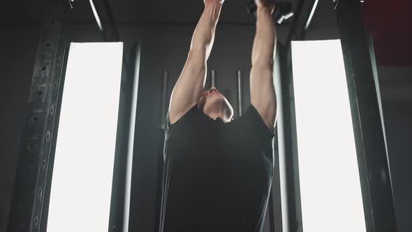 Physical Activity Young Disabled Athlete in Wheelchair Performs Pullups on the Horizontal Bar Gym alt