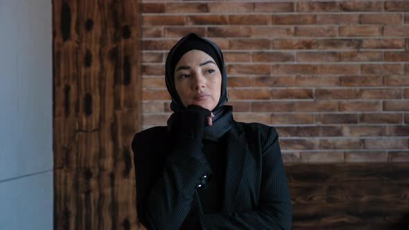 Thoughtful Concerned Business Young Muslim Arabian Woman in Hijab Thinking Solving Problem in Office