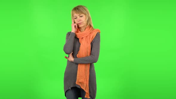 Middle Aged Blonde Woman Is Thinking About Something, and Then an Idea Coming To Her. Green Screen alt