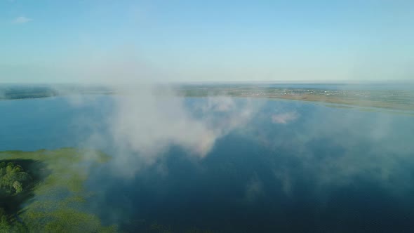Flight in the Clouds Over the Island of Lake Svityaz alt