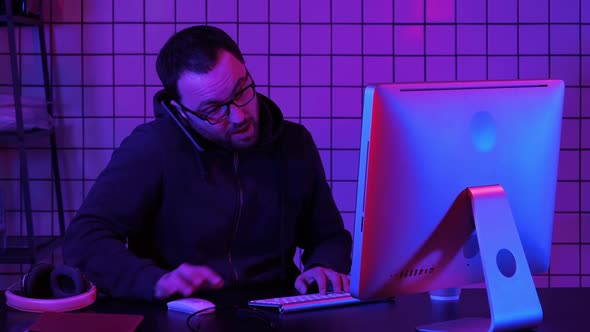 Professional Hacker Using Mobile Cell Phone Talking and Spreading Bad Data Virus Online alt