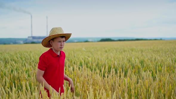 Funny boy gives straw hat to a younger brother alt