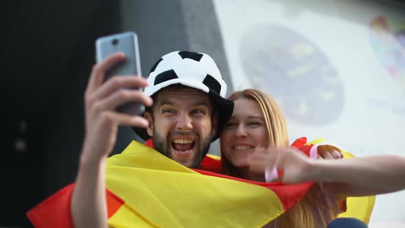 Spanish Football Supporters Calling via Video App to Friends From Stadium alt