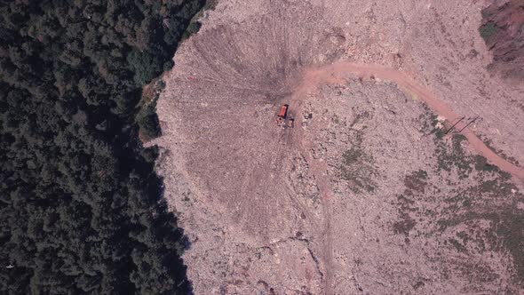 Bird's Eye View of a Garbage Dump Where Machinery Equals Mountains of Household Waste, Ukraine