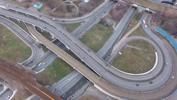 Drone flies over the road urban junction. Highway in Moscow. Bird's eye view.